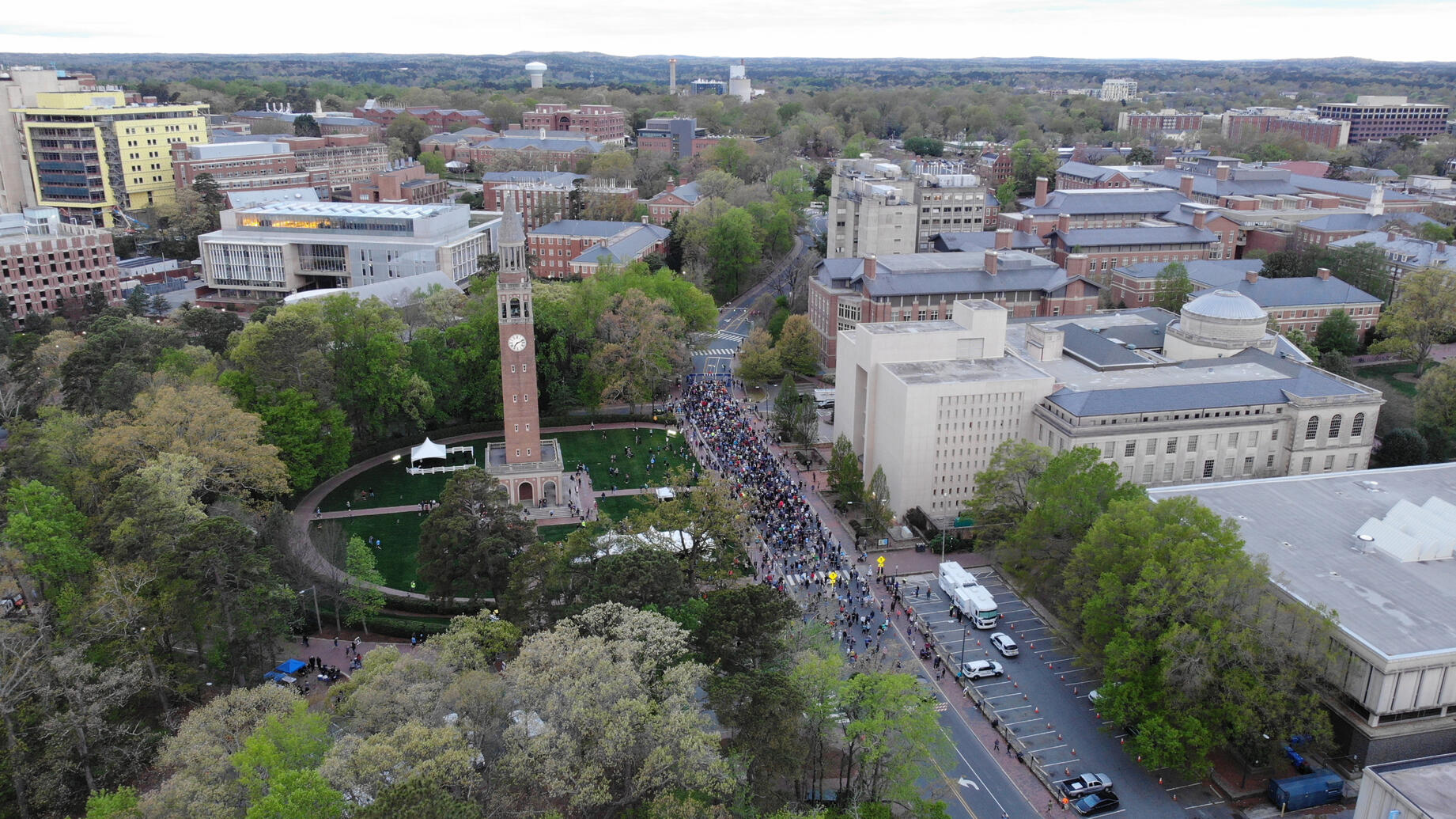 An aerial shot of a large group of people lining up on a college campus for a race