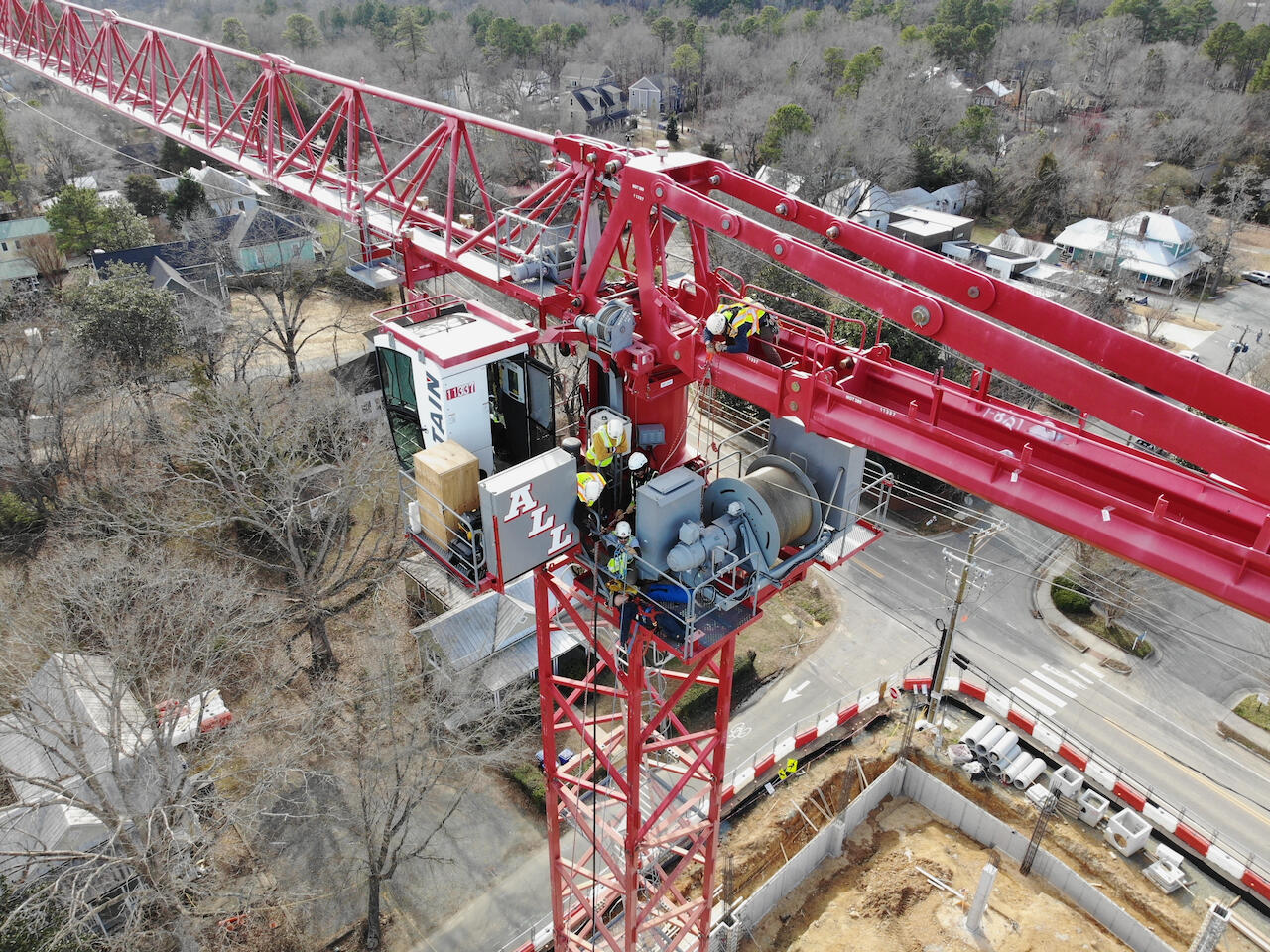 A picture of a group of rescuers working on a crane taking from above